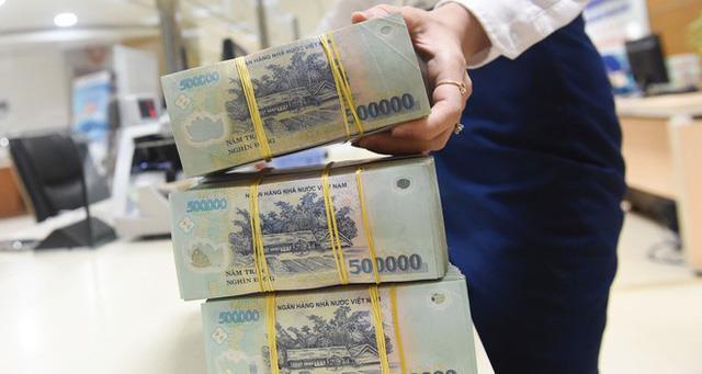 Ngân hàng thu hồi nợ thêm chật vật vì bất động sản đóng băng - Ảnh 1.